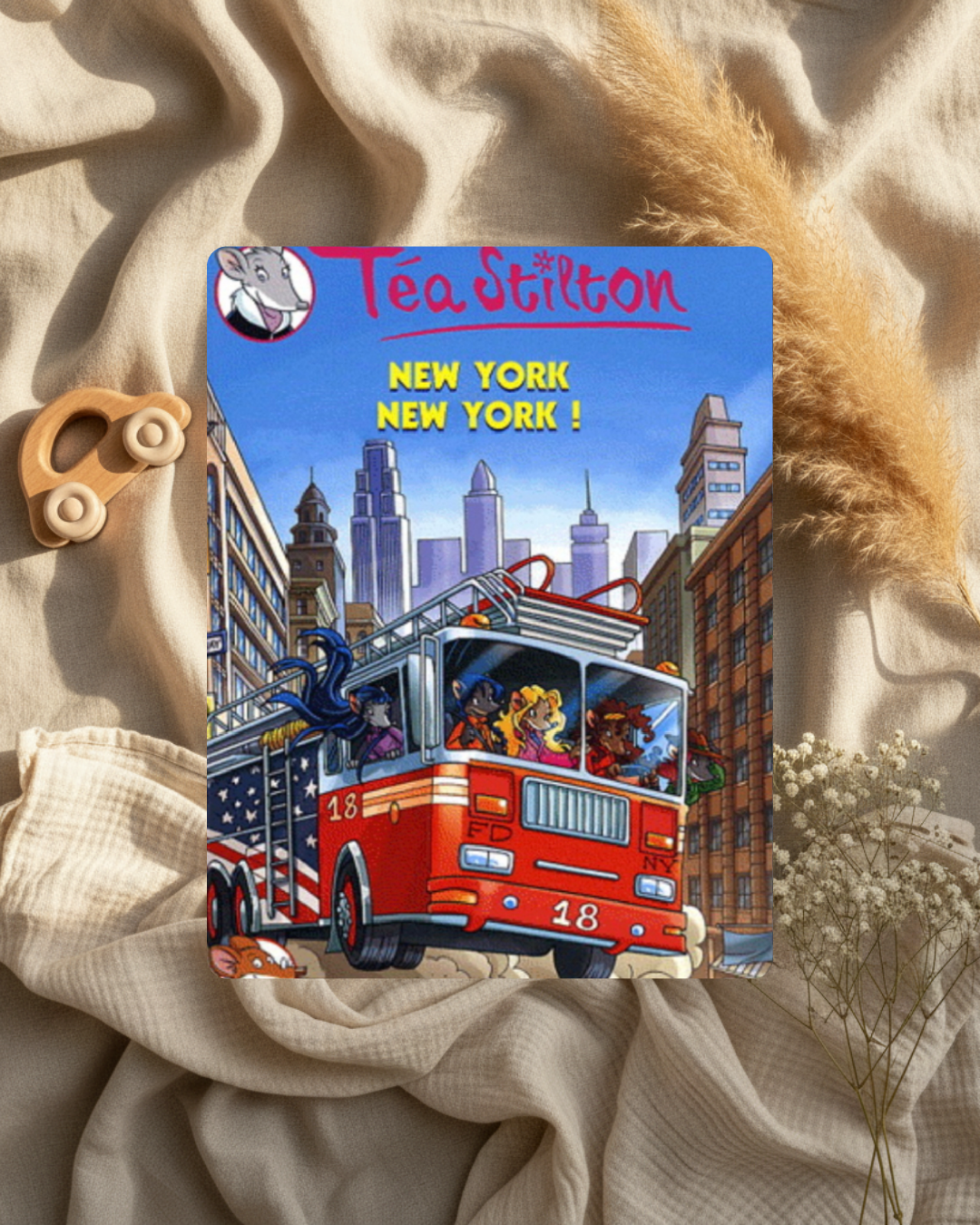 Livre Téa Stilton « New York NewYork », couverture avec bus rouge et gratte-ciel.