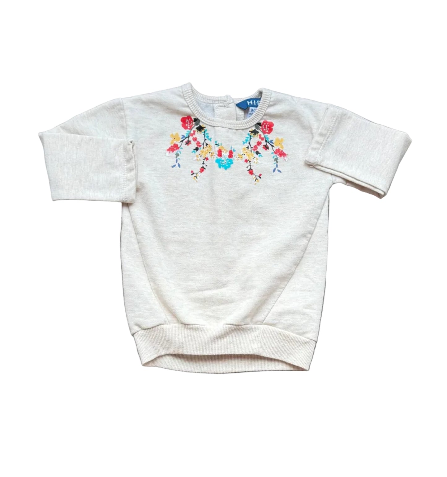 Tunique bébé en tissu clair, encolure ronde, manches longues, broderie florale colorée