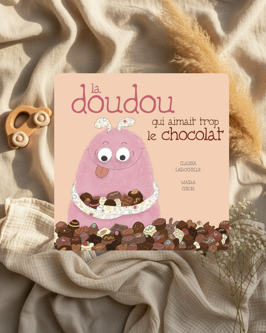 Livre pour enfants à couverture rose : doudou violet au chocolat et titre en lettres stylisées