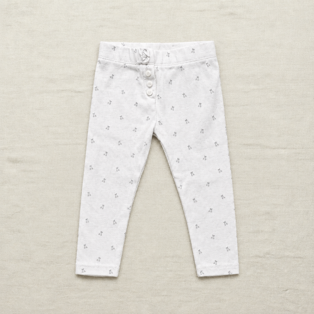 Legging bébé blanc à petits motifs, taille élastique boutonnée et fermeture à bouton