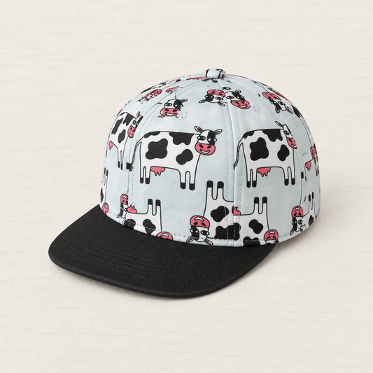 Casquette enfant 2-7 ans blanche à motif animaux (vaches) et visière noire
