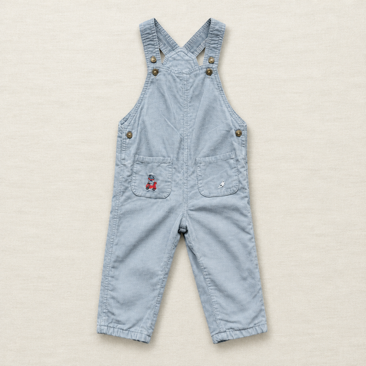 Salopette Sergent Major bleu clair en jean, bretelles croisées, boutons, poches à rabat