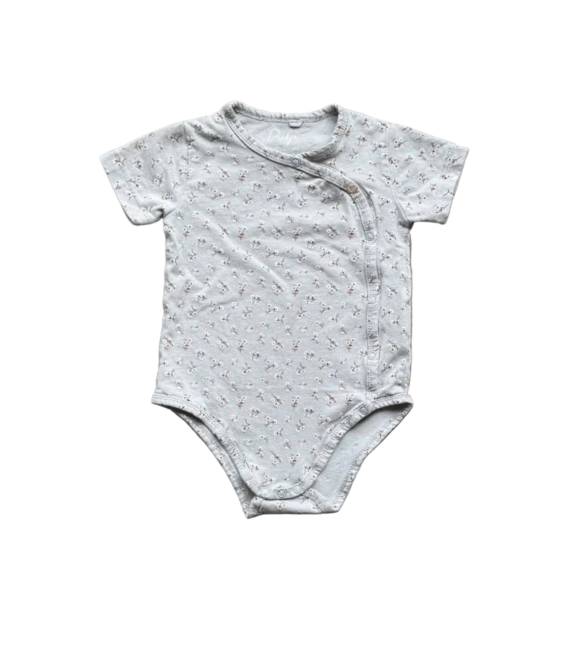 Body bébé manches courtes tissu clair à motifs fins, fermeture pression à l’avant.