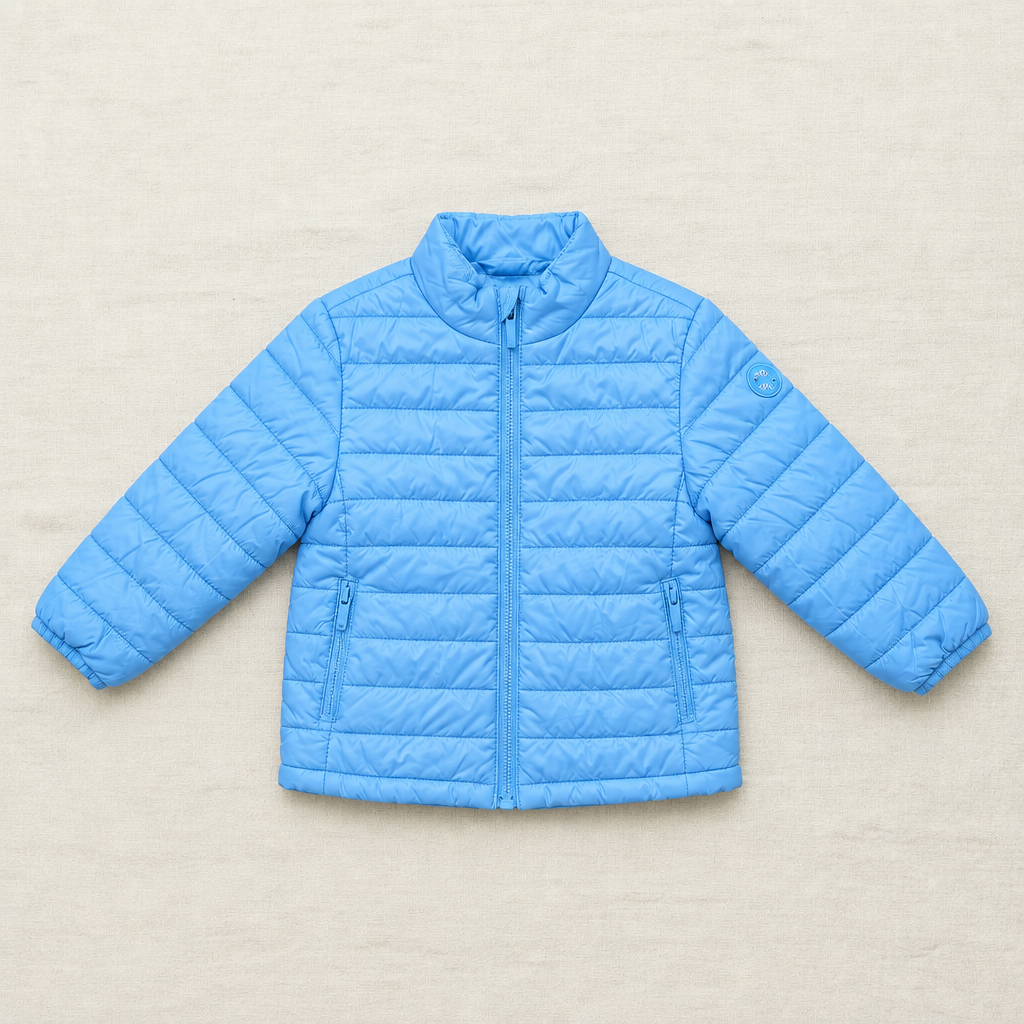 Manteau matelassé bleu glacier à fermeture zippée, col montant et poches sur le côté