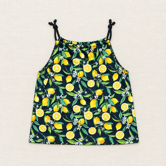 Camisole enfant à fines bretelles nouées, imprimé citrons jaunes sur fond bleu foncé