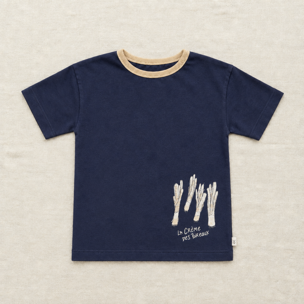 T-shirt enfant bleu marine, col beige et motif crème au bas
