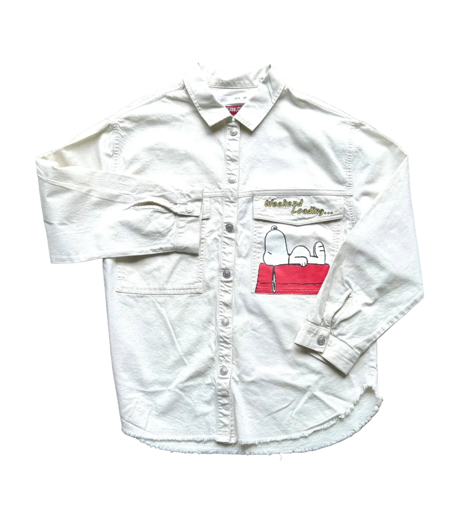 Chemise enfant blanche à manches longues, poche poitrine et motif Peanuts
