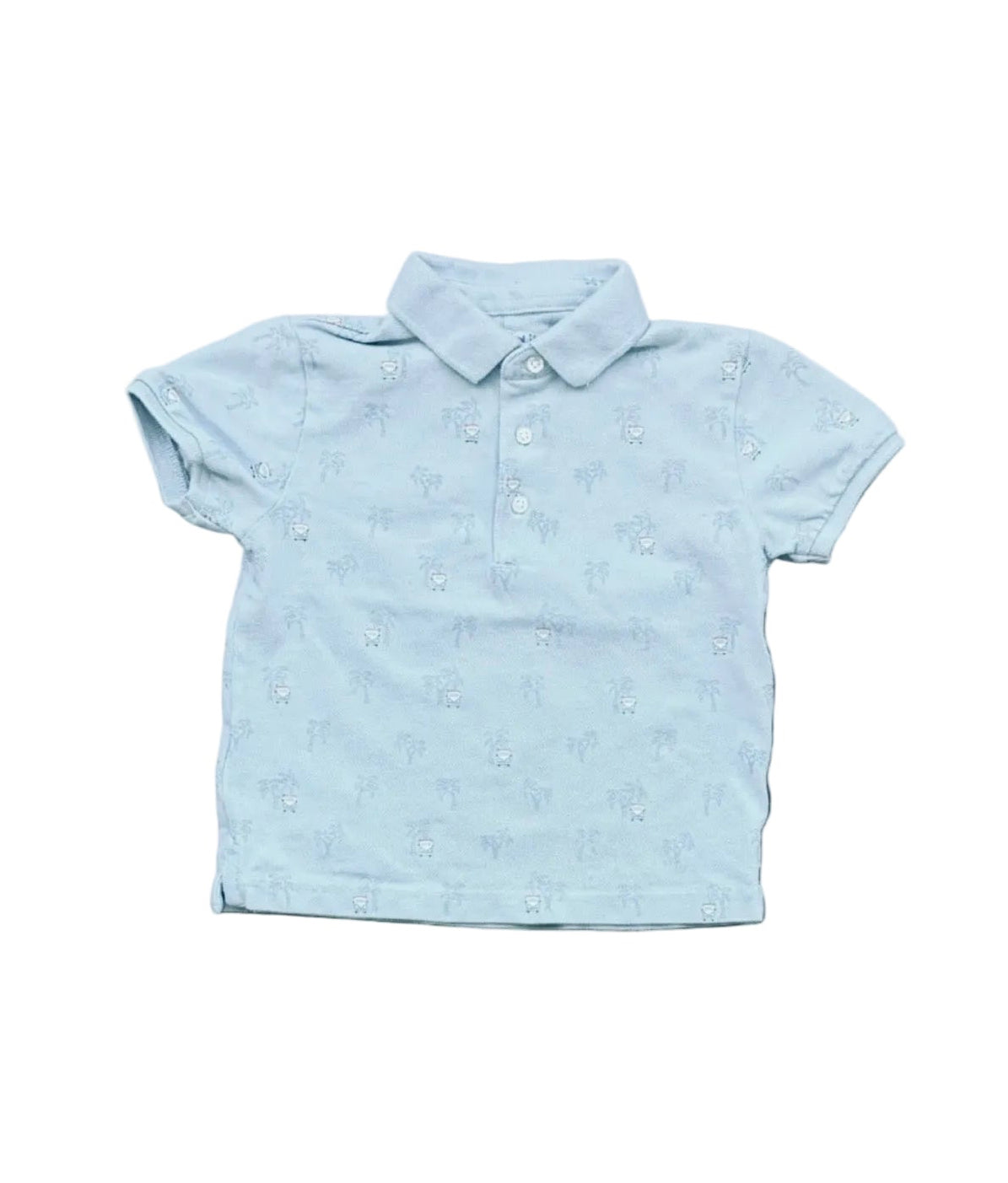 Polo bleu ciel manches courtes, col chemise, boutons et petits motifs.