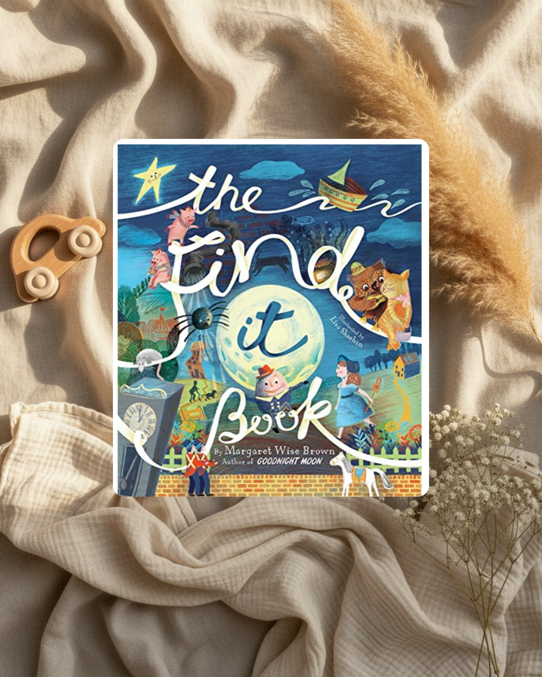 Livre « The find it book » à couverture bleue avec chats, enfants et planètes