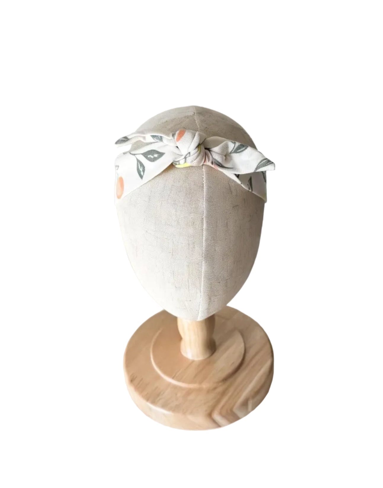 Bandeau bébé blanc avec nœud sur le dessus, motif feuilles et fruits