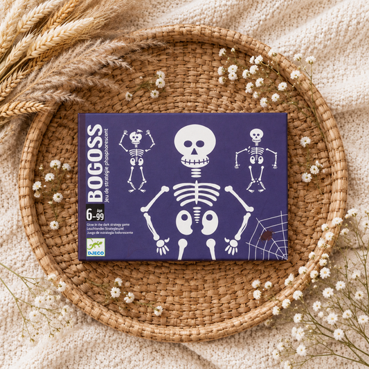 Boîte du jeu Djeco Bogoss 6-99 : squelettes blancs sur fond violet.