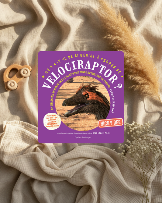 Livre jeunesse à couverture violette avec illustration de vélociraptor