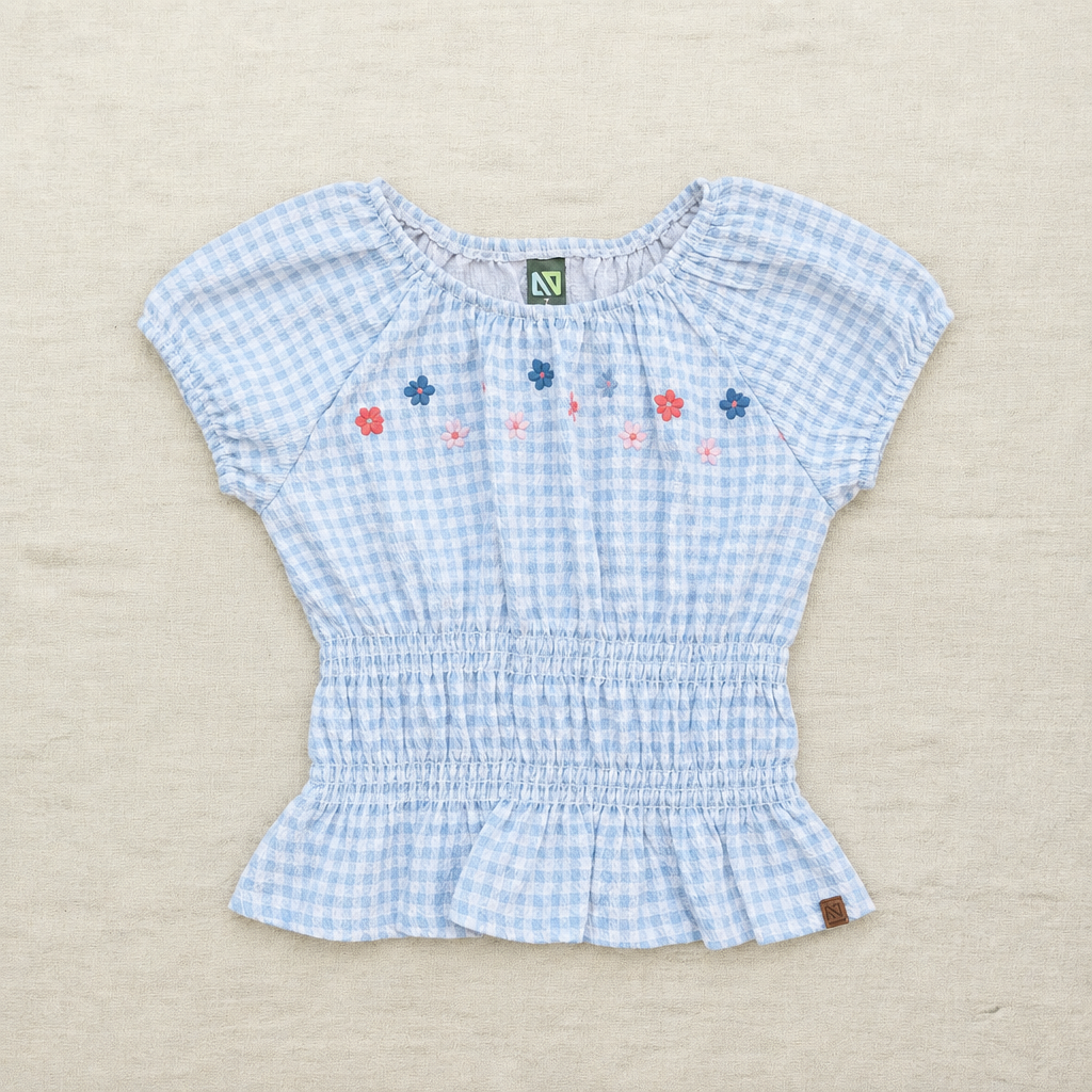 Tunique enfant en coton bleu clair à carreaux et broderie de fleurs, manches bouffantes