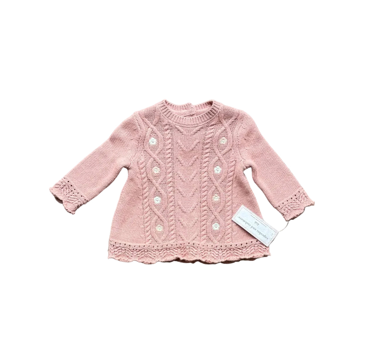 Robe tricot rose bébé, manches longues, col rond, motif ajouré et bord volant