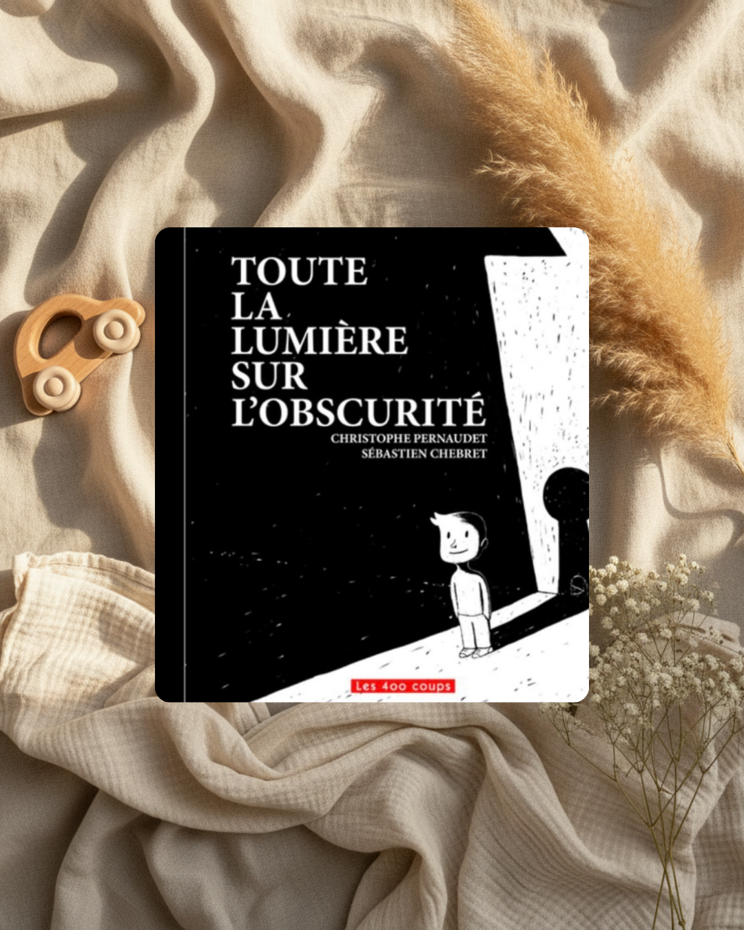 Livre à couverture noire, titre en lettres blanches et illustration