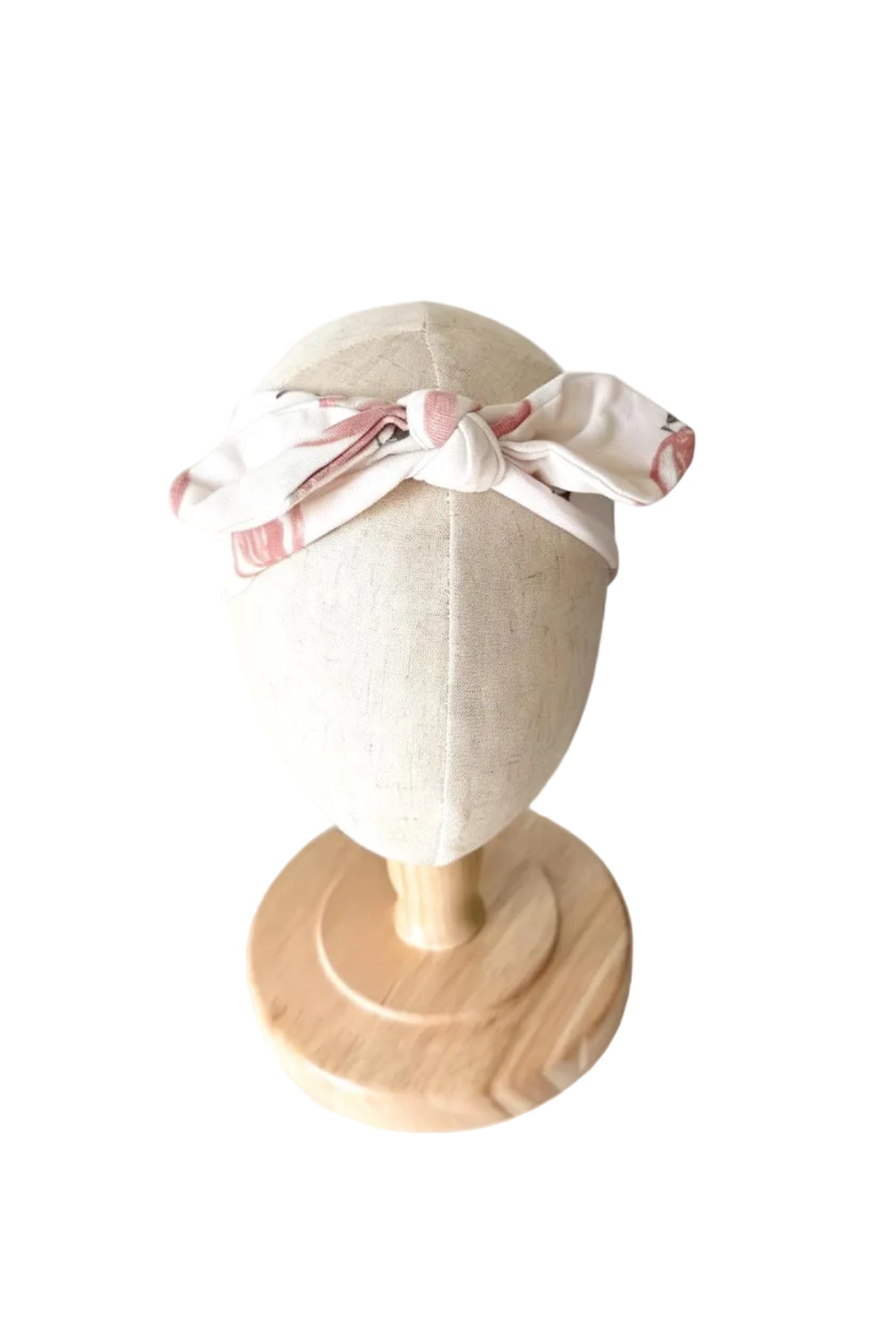 Bandeau bébé noué sur le dessus, tissu blanc cassé à rayures roses
