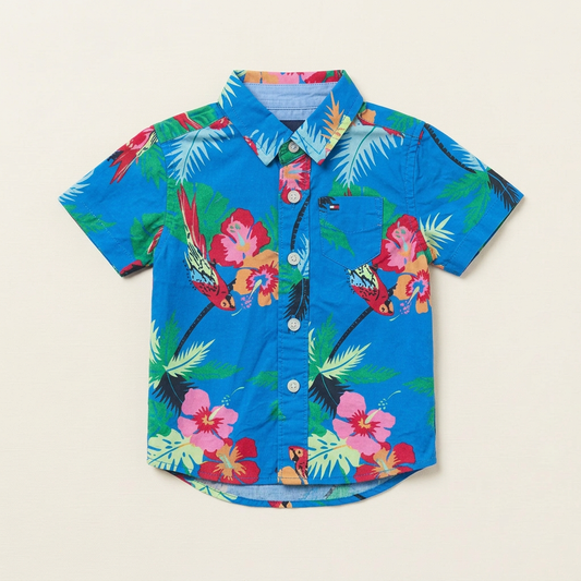 Chemise bébé Tommy Hilfiger bleue à manches courtes, col et boutonnière, motif jungle.