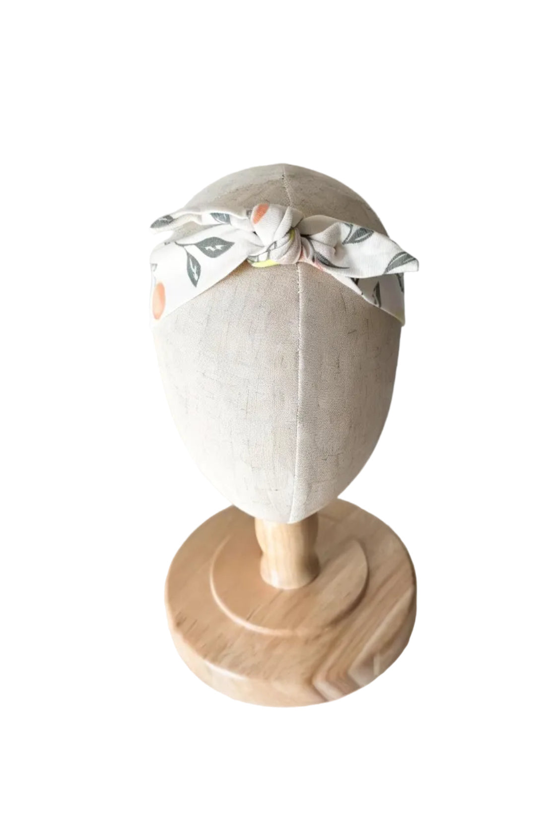 Bandeau bébé beige avec nœud et imprimé fruits colorés