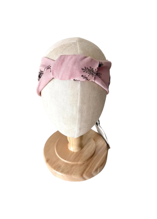 Bandeau bébé Deux par Deux rose avec broderies florales noires et nœud noué