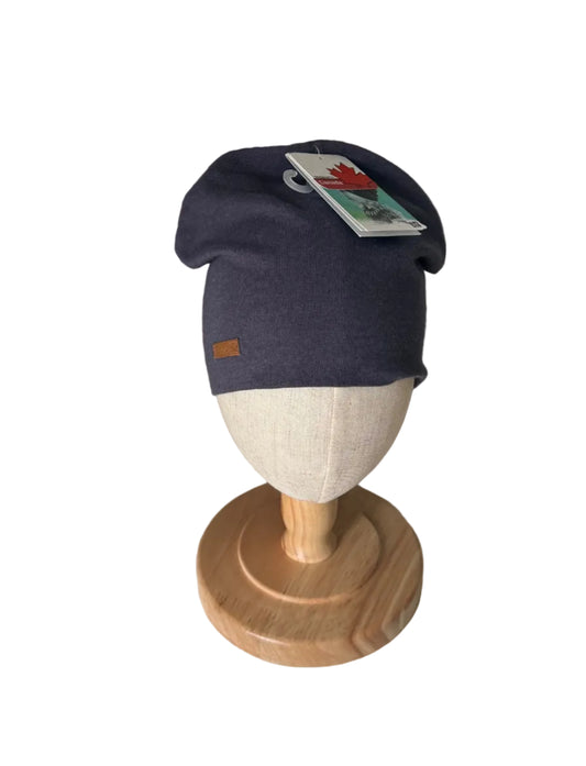 Bonnet bébé marine 12-24 mois, doublure beige, étiquette sur le côté.