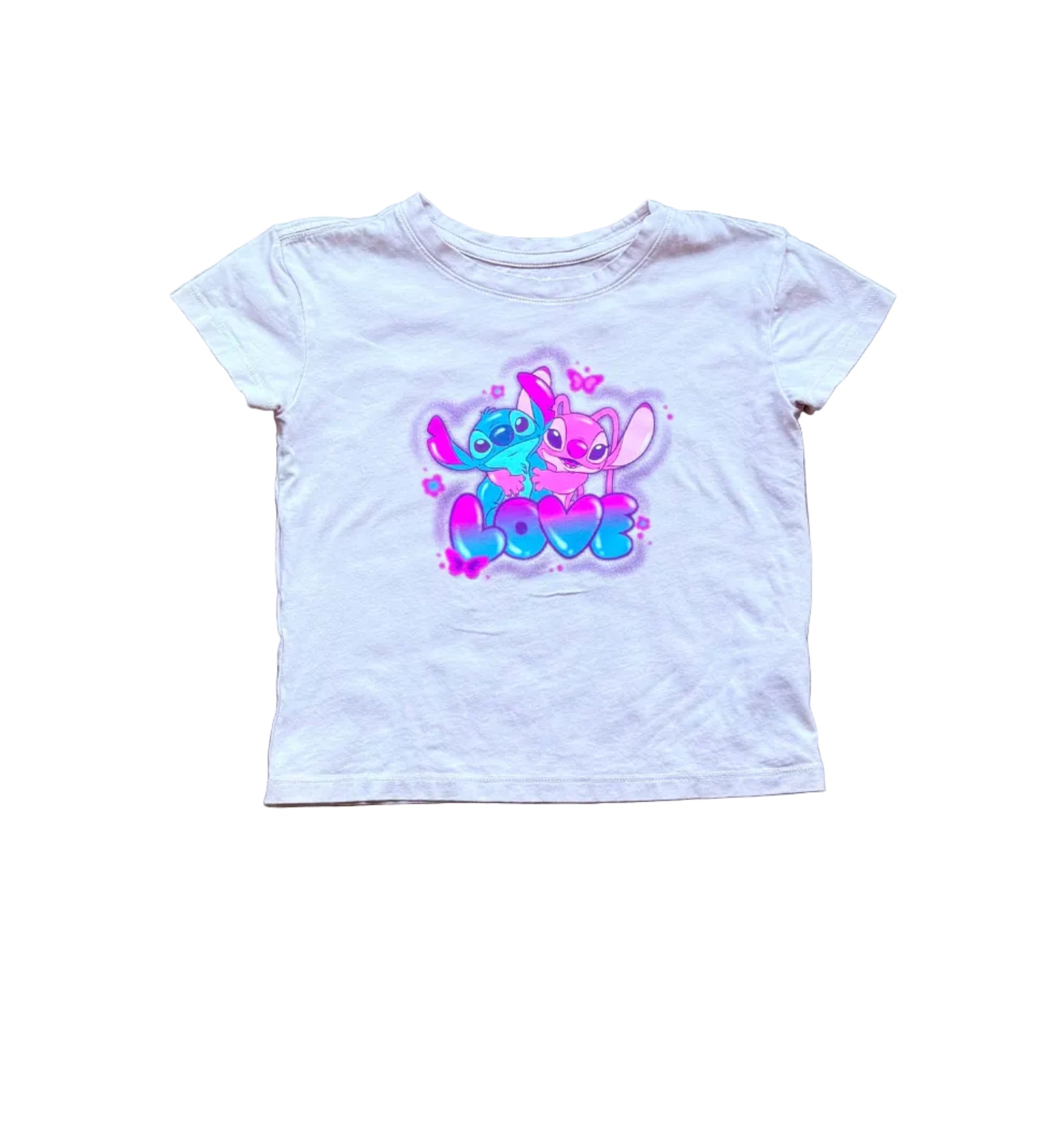 T-shirt enfant Disney 5 ans en coton clair, imprimé Stitch multicolore au centre.
