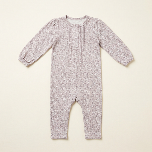 Combinaison bébé Fixoni 6 mois à manches longues, motif floral, fermeture boutons devant.