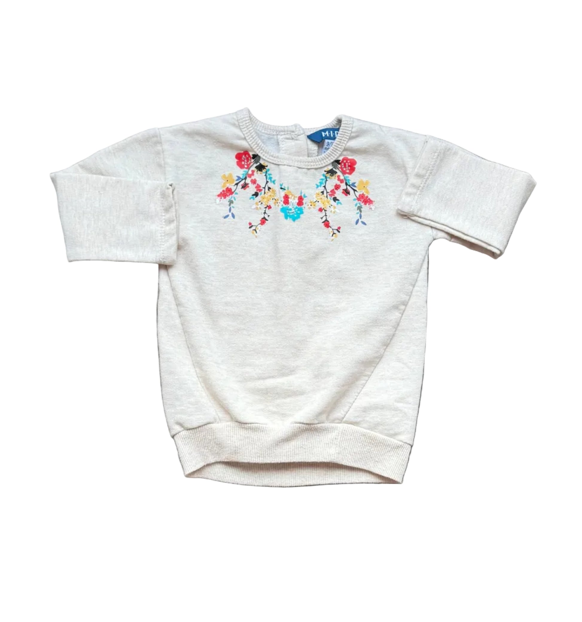 Tunique bébé en tissu clair, encolure ronde, manches longues, broderie florale colorée