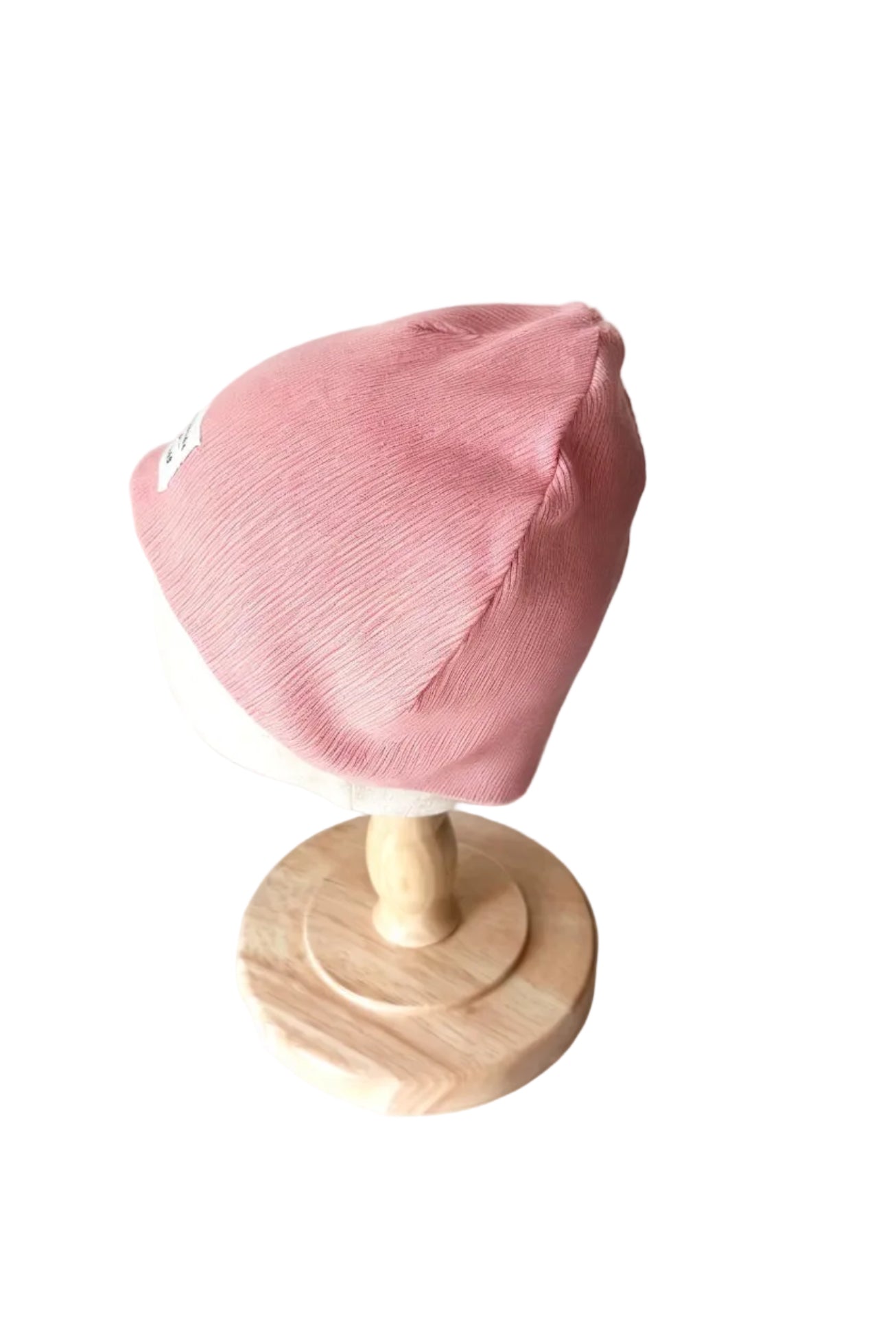 Bonnet H&M bébé rose 18-24 mois, vue de côté, maille côtelée repliée.