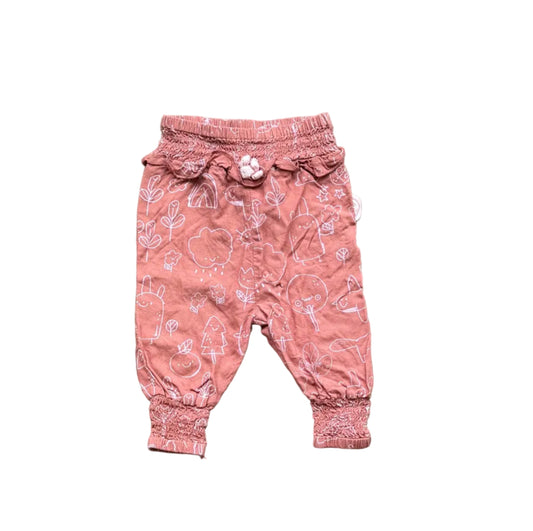 Pantalon bébé rose rosé à motifs animés, taille élastique, bas resserrés.